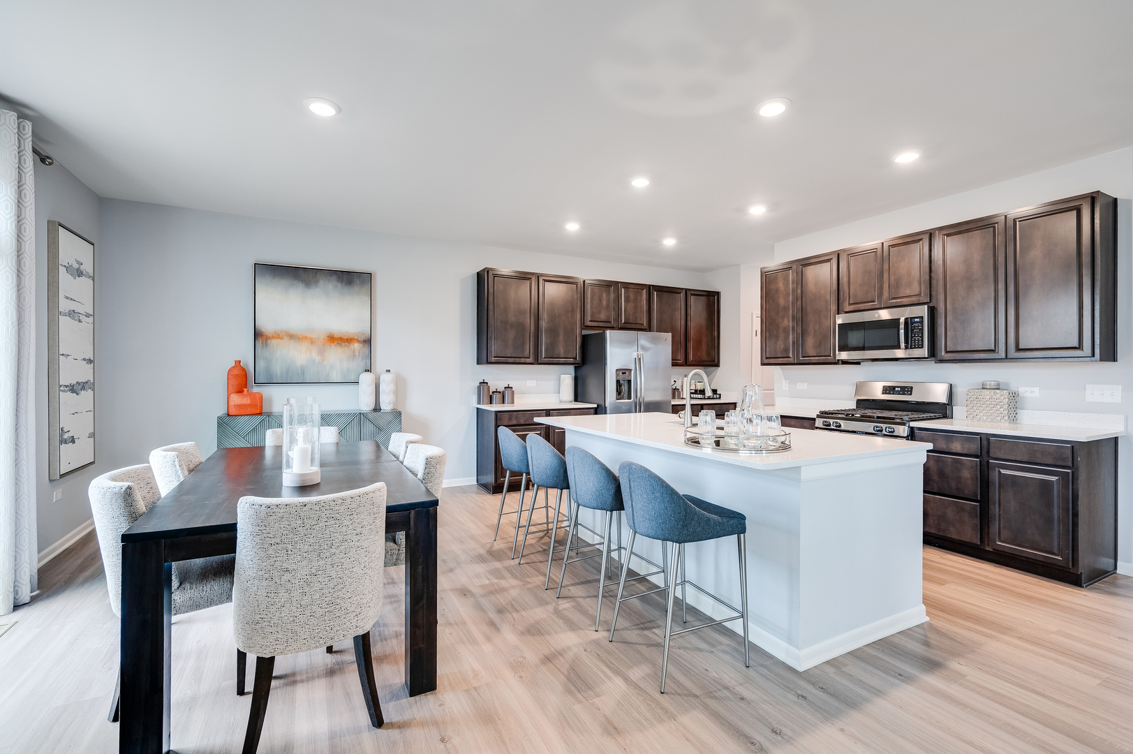 2895 Killarny Drive Elgin, IL 60124 - Photo 6 of 23 a kitchen with stainless steel appliances kitchen island granite countertop a stove top oven a sink a refrigerator and a island