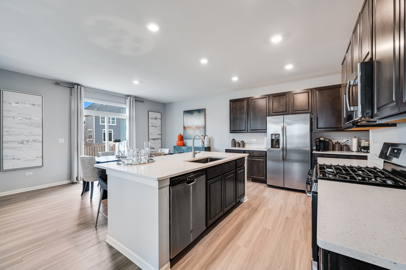 2895 Killarny Drive Elgin, IL 60124 - Photo 7 of 23 a kitchen with stainless steel appliances granite countertop a sink stove and refrigerator