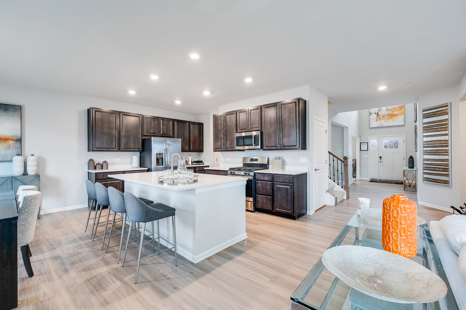 2895 Killarny Drive Elgin, IL 60124 - Photo 8 of 23 a living room with stainless steel appliances kitchen island granite countertop furniture a kitchen island a couches and a refrigerator
