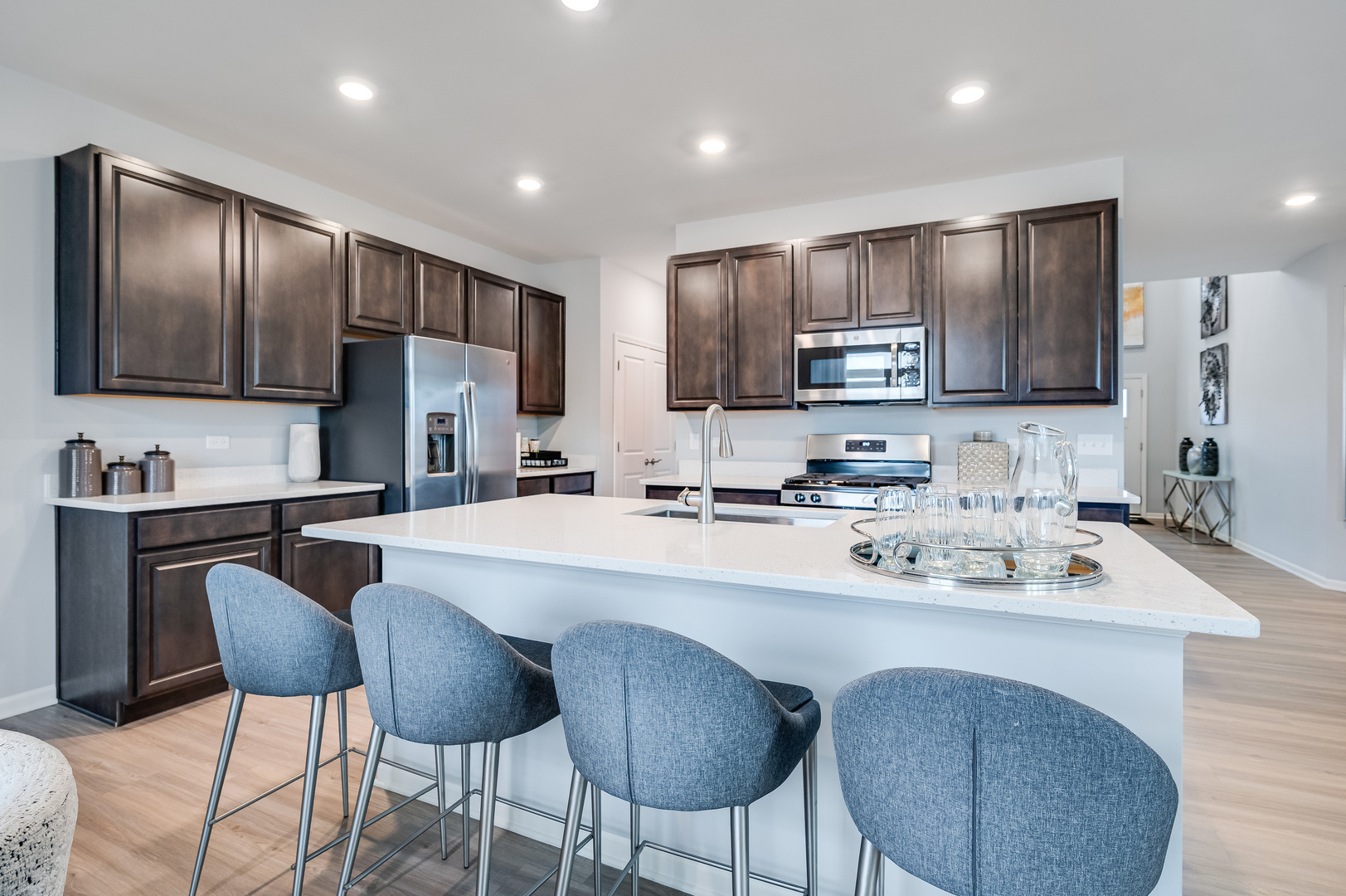 2895 Killarny Drive Elgin, IL 60124 - Photo 9 of 23 a kitchen with stainless steel appliances granite countertop a sink refrigerator and cabinets