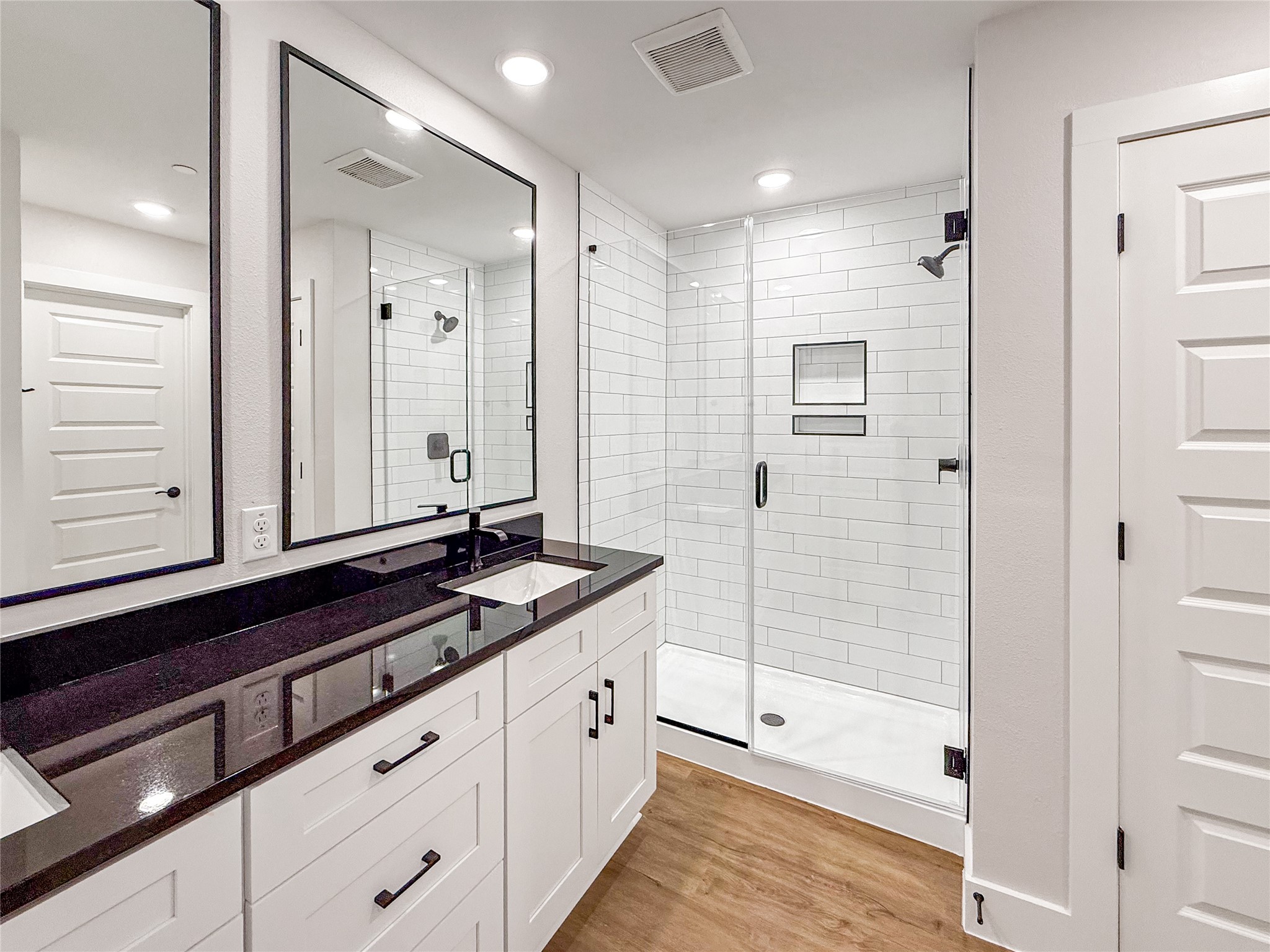 5611 Mobeetie Loop Bee Cave, TX 78738 - Photo 17 of 22 a bathroom with double vanity and a shower