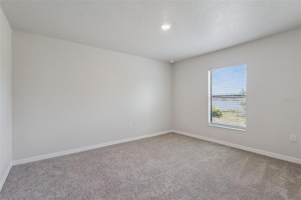 1613 Orne Street Mascotte, FL 34753 - Photo 18 of 31 an empty room with windows