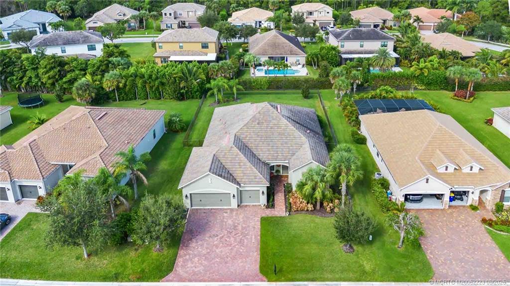 1092 Southwest Scrub Oak Avenue Palm City, FL 34990 - Photo 2 of 45 an aerial view of residential houses with outdoor space and street view