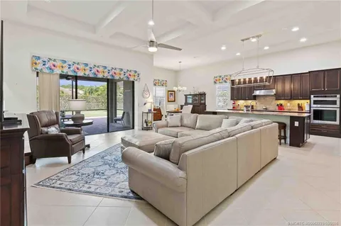 a dining room with a large window table and chairs