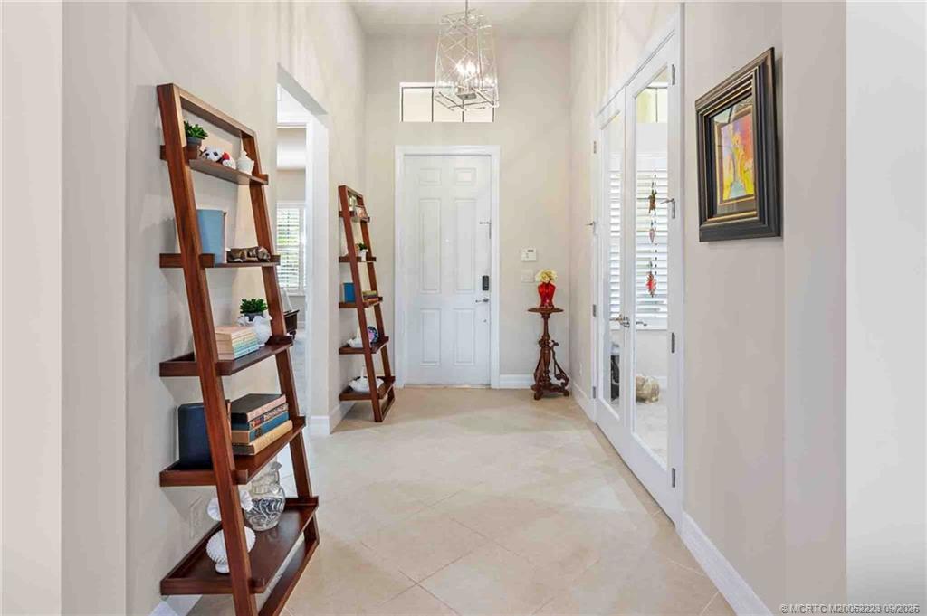 1092 Southwest Scrub Oak Avenue Palm City, FL 34990 - Photo 29 of 45 a view of an front door with a hallway