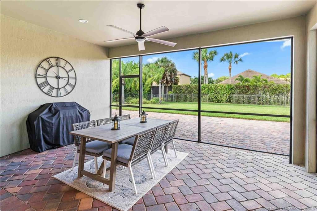 1092 Southwest Scrub Oak Avenue Palm City, FL 34990 - Photo 34 of 45 a view of a dining room with furniture window and outside view