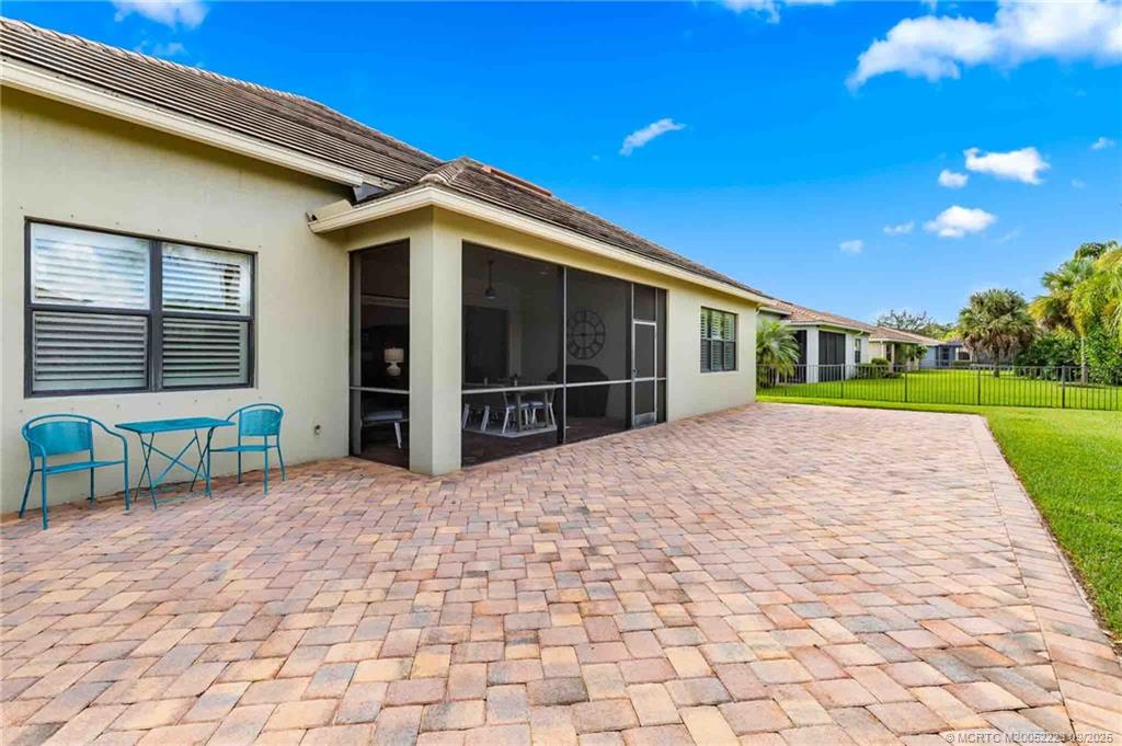 1092 Southwest Scrub Oak Avenue Palm City, FL 34990 - Photo 36 of 45 a view of a house with a patio