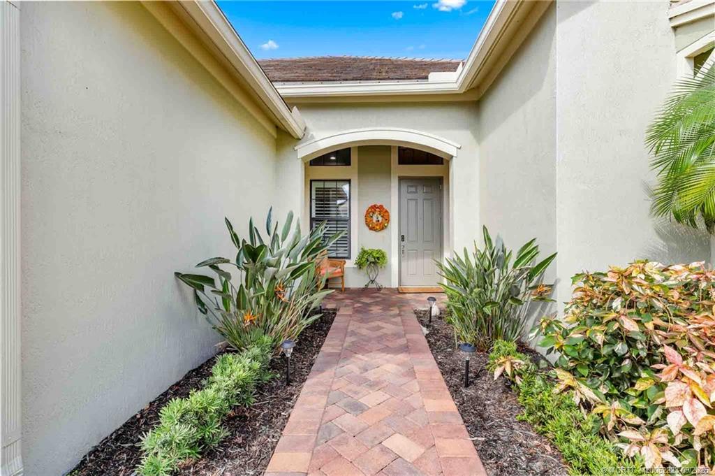 1092 Southwest Scrub Oak Avenue Palm City, FL 34990 - Photo 38 of 45 a view of a entryway door of the house