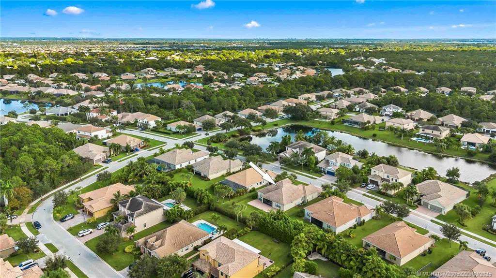 1092 Southwest Scrub Oak Avenue Palm City, FL 34990 - Photo 4 of 45 an aerial view of residential houses with outdoor space