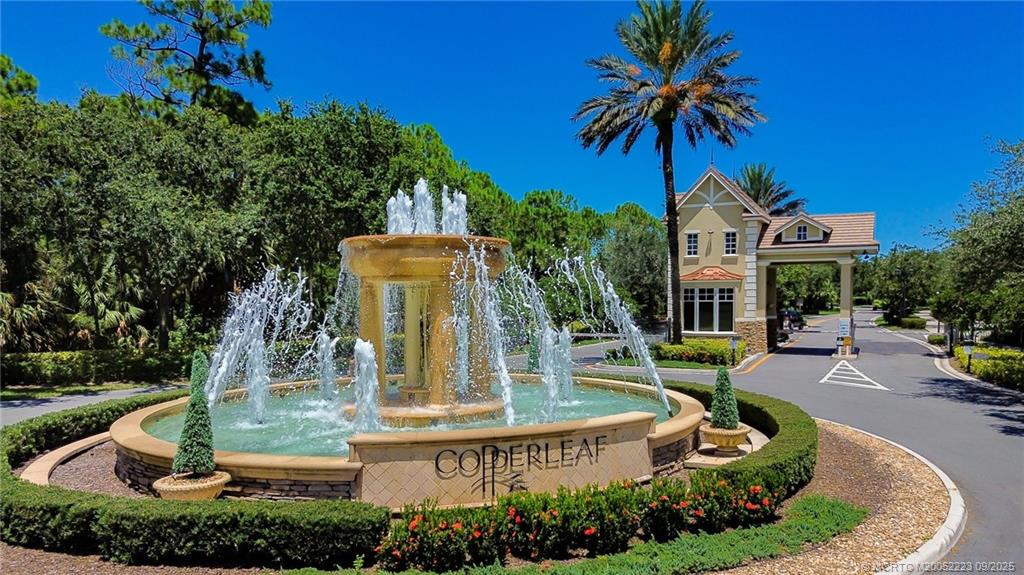 1092 Southwest Scrub Oak Avenue Palm City, FL 34990 - Photo 41 of 45 a view of a house with swimming pool and garden