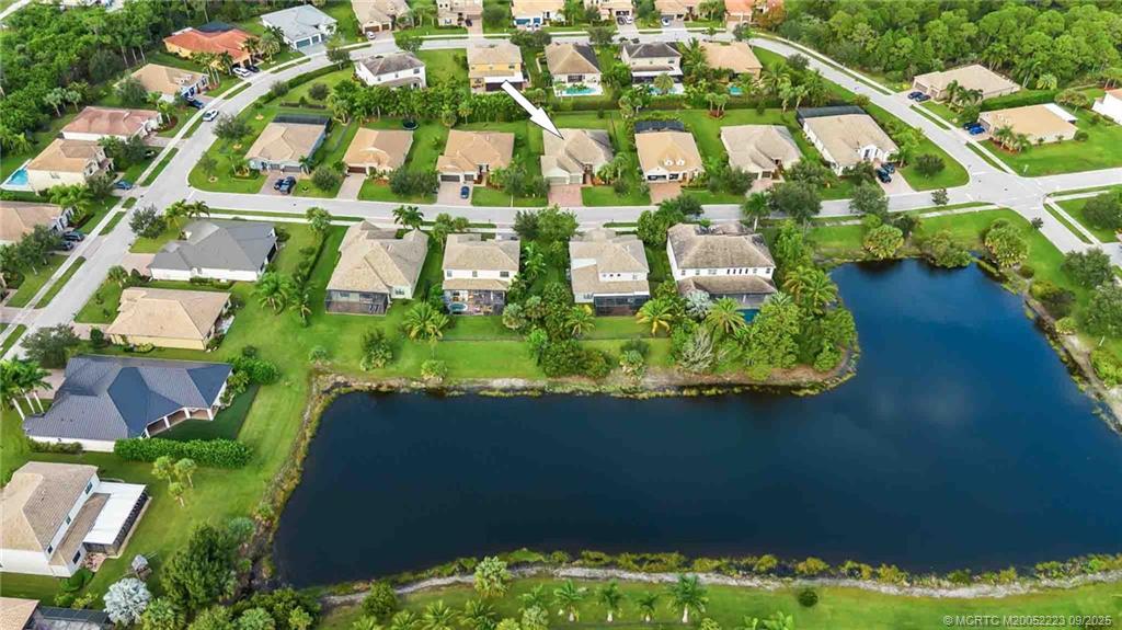 1092 Southwest Scrub Oak Avenue Palm City, FL 34990 - Photo 6 of 45 an aerial view of residential houses with outdoor space and street view
