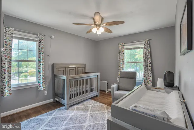 a bedroom with furniture and windows