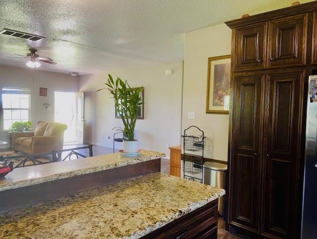 1002 Farm To Market 55 Barry, TX 75102 - Photo 21 of 21 a room with kitchen island granite countertop furniture and a refrigerator