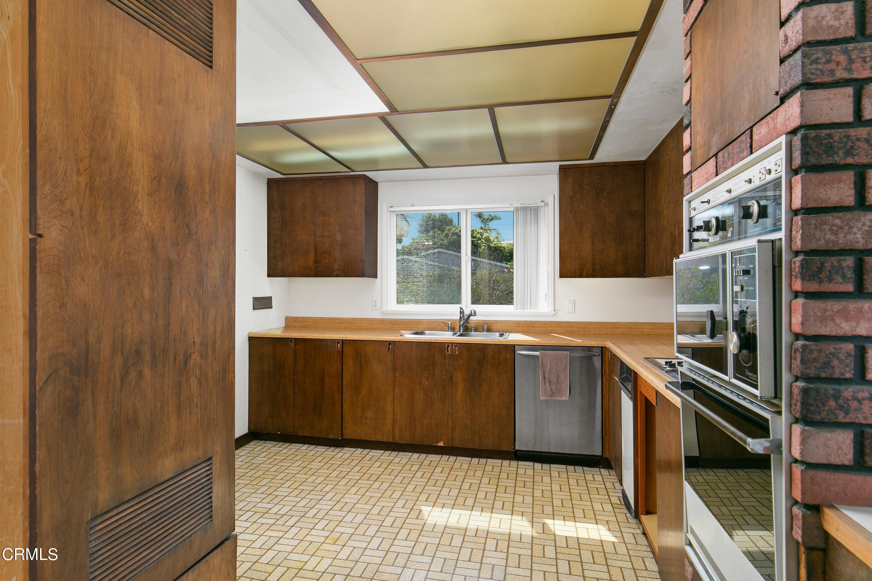 4721 Reese Road Torrance, CA 90505 - Photo 14 of 32 a kitchen with stainless steel appliances a sink stove and cabinets