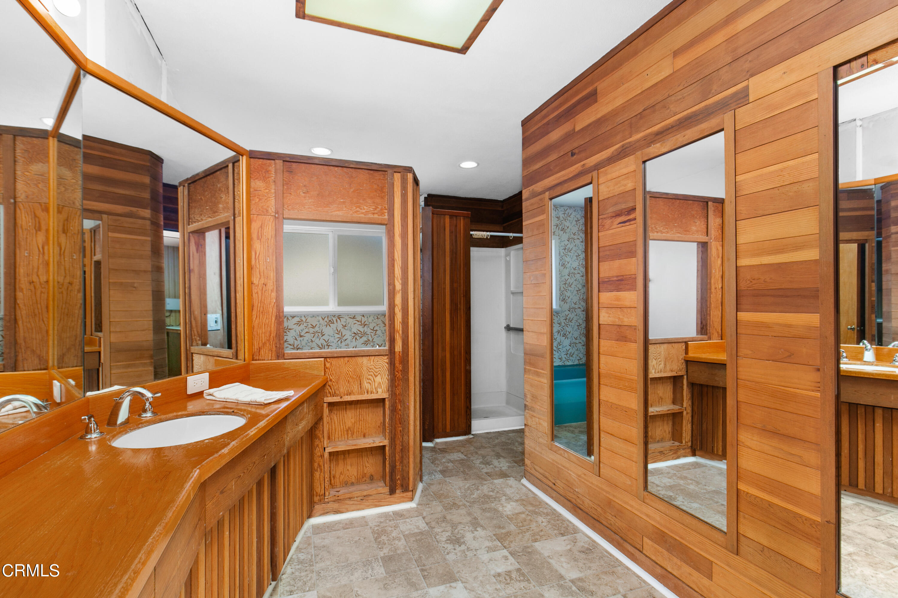 4721 Reese Road Torrance, CA 90505 - Photo 23 of 32 a bathroom with a tub sink shower and mirror