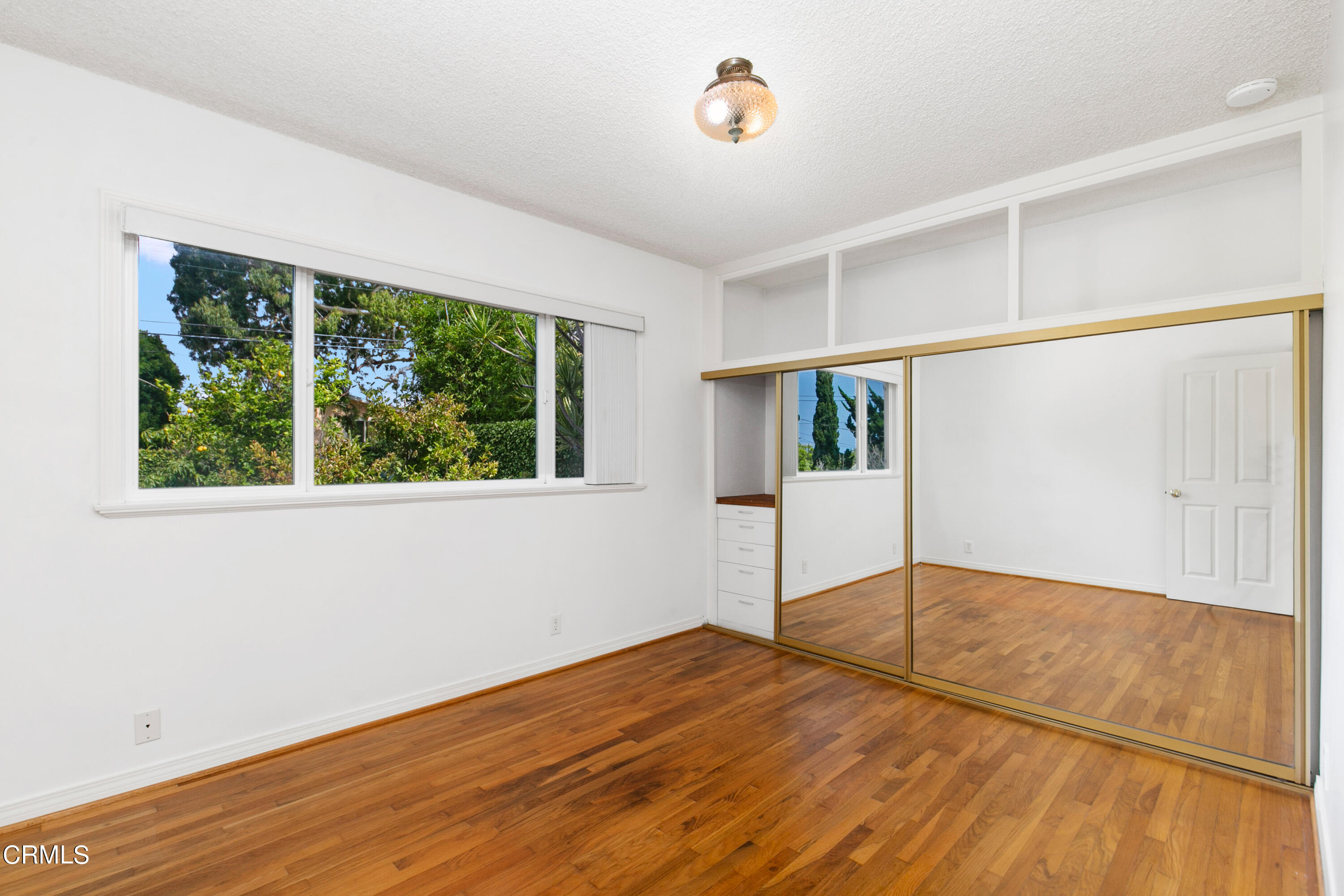 4721 Reese Road Torrance, CA 90505 - Photo 25 of 32 an empty room with wooden floor and windows