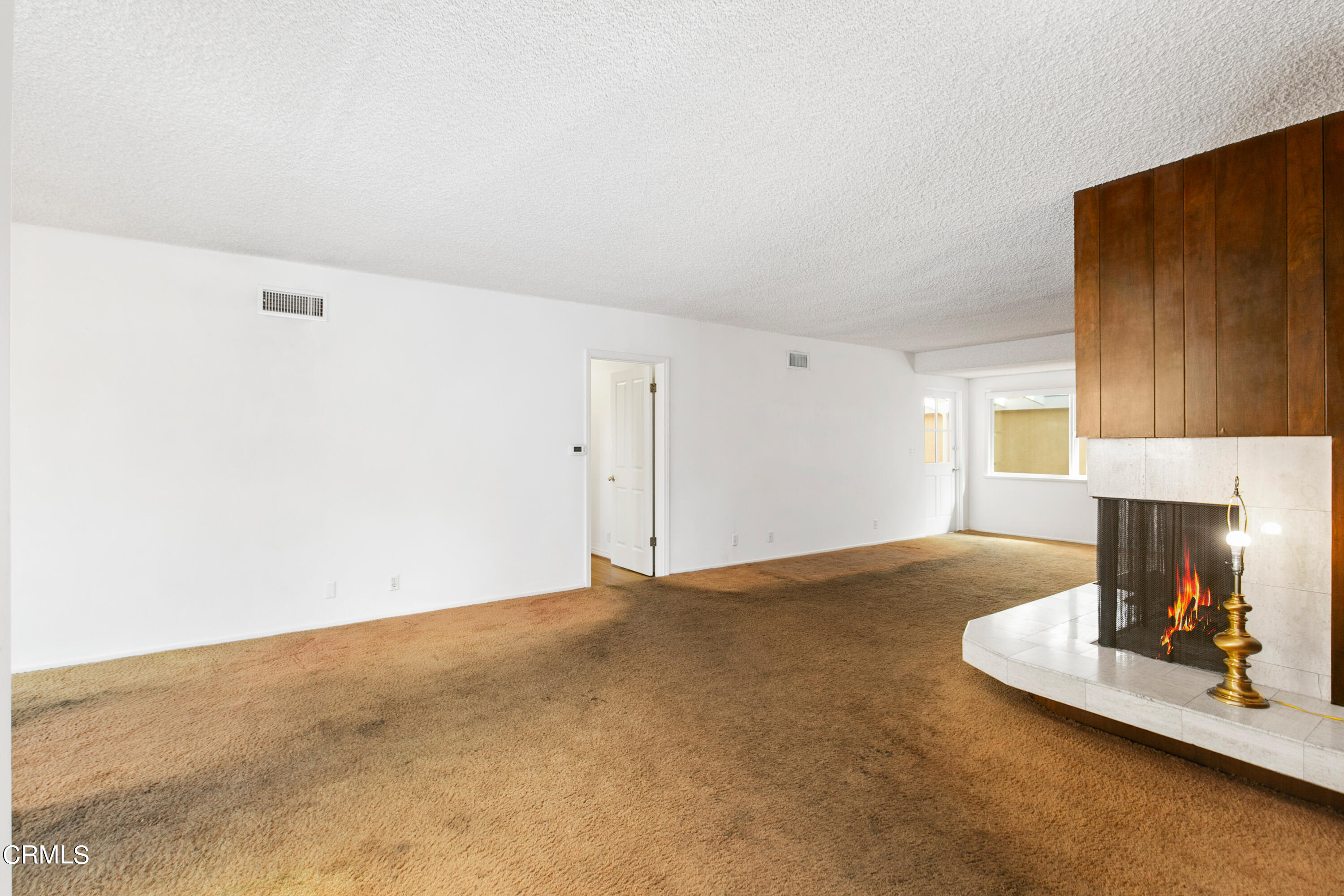 4721 Reese Road Torrance, CA 90505 - Photo 6 of 32 a view of a livingroom with a fireplace and window