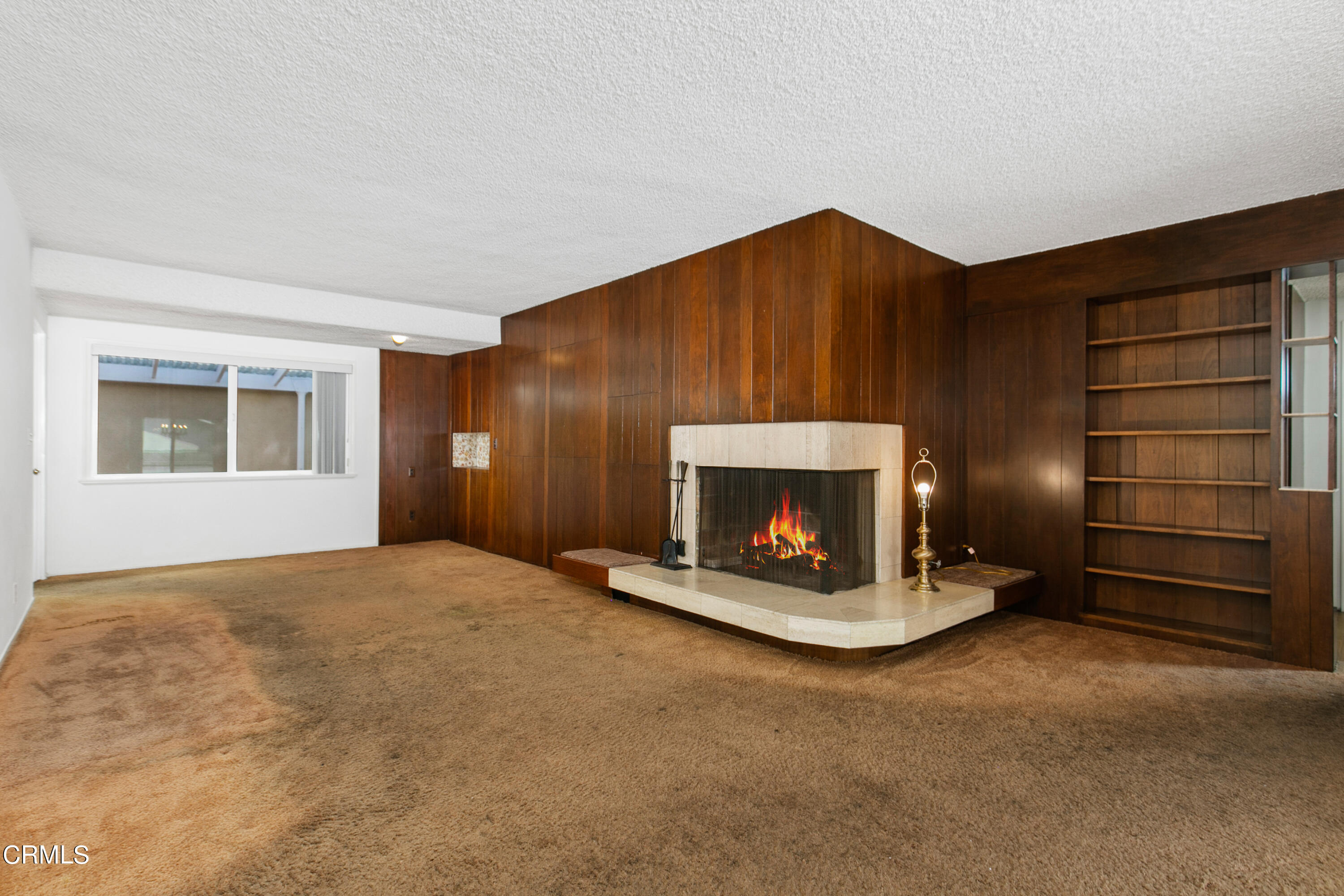 4721 Reese Road Torrance, CA 90505 - Photo 7 of 32 a view of an empty room with a fireplace and window