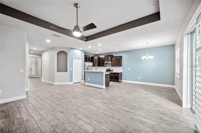 a view of a kitchen with a stove and cabinets