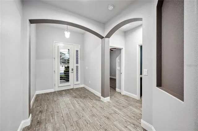 a view of hallway with wooden floor