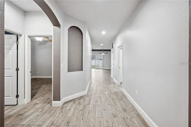 view of a hallway with wooden floor
