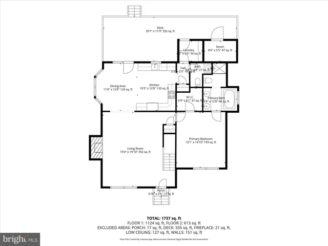 a picture of a bench in front of a white house