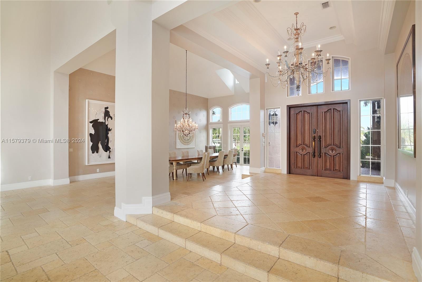 6225 Stallion Way Southwest Ranches, FL 33330 - Photo 12 of 56 a view of a livingroom with a dinning area fireplace and chandelier