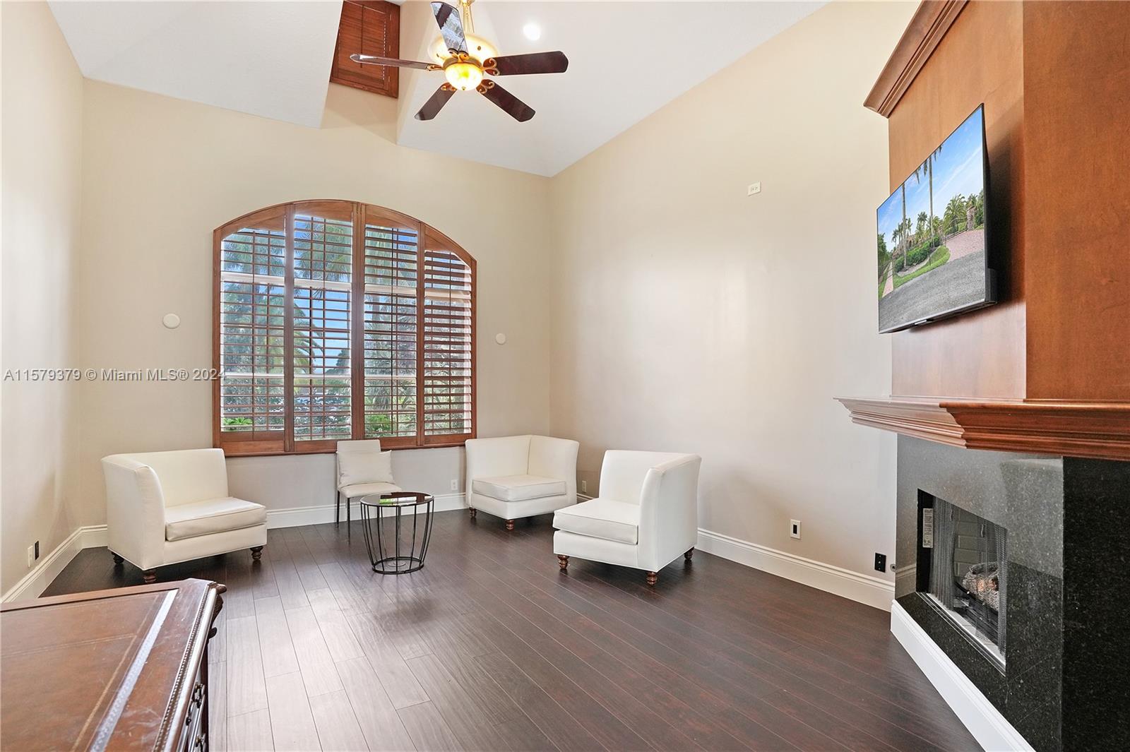 6225 Stallion Way Southwest Ranches, FL 33330 - Photo 18 of 56 a living room with furniture and a fireplace