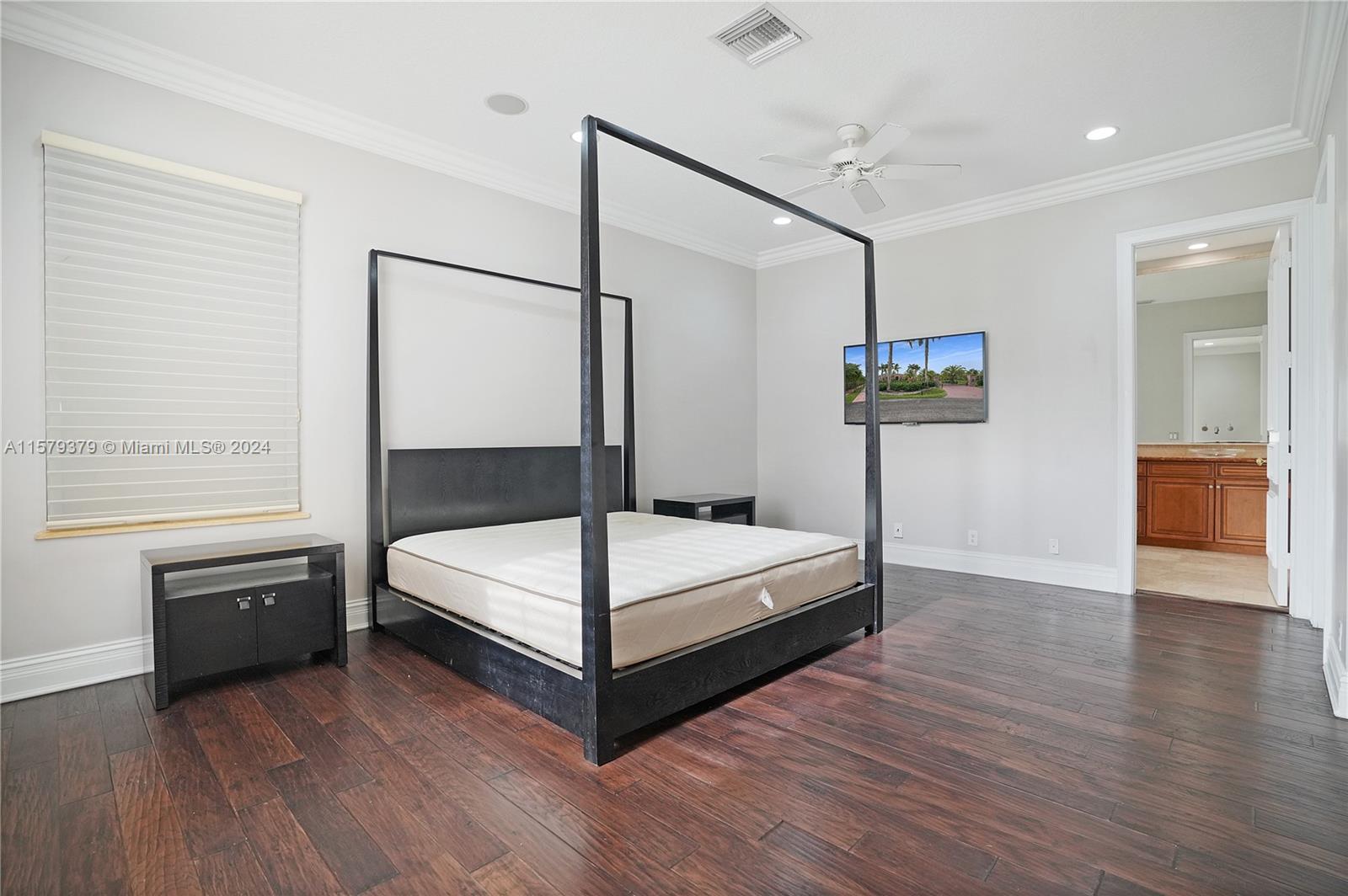6225 Stallion Way Southwest Ranches, FL 33330 - Photo 19 of 56 a bedroom with a bed and a table