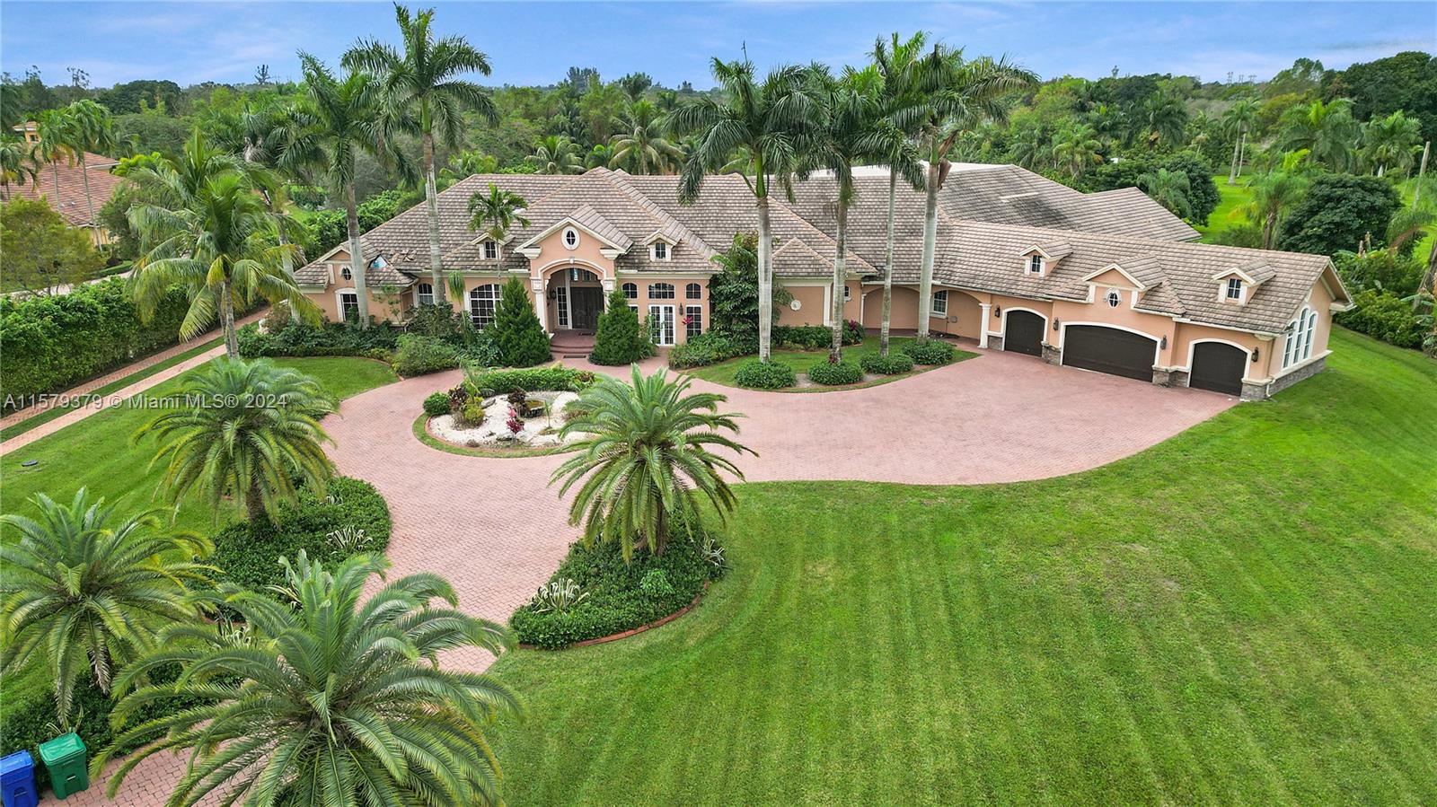 6225 Stallion Way Southwest Ranches, FL 33330 - Photo 2 of 56 a aerial view of a house with a garden