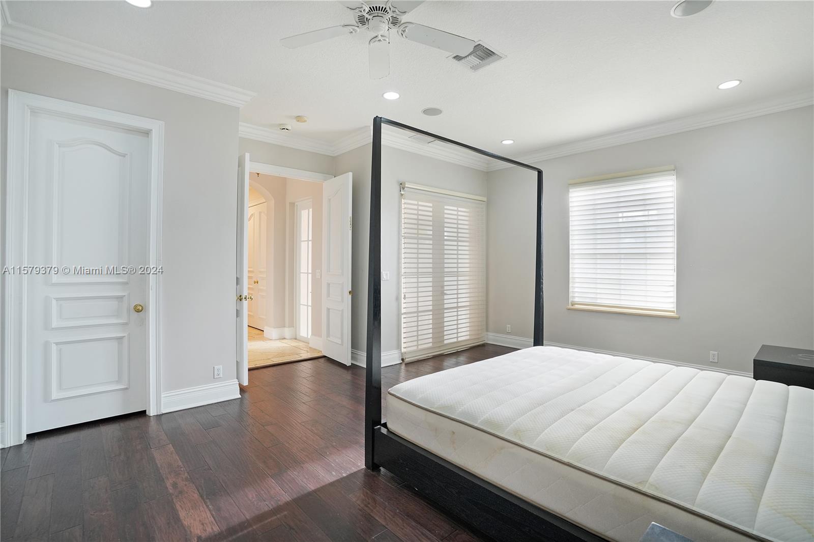 6225 Stallion Way Southwest Ranches, FL 33330 - Photo 22 of 56 a bedroom with a large bed and a chandelier