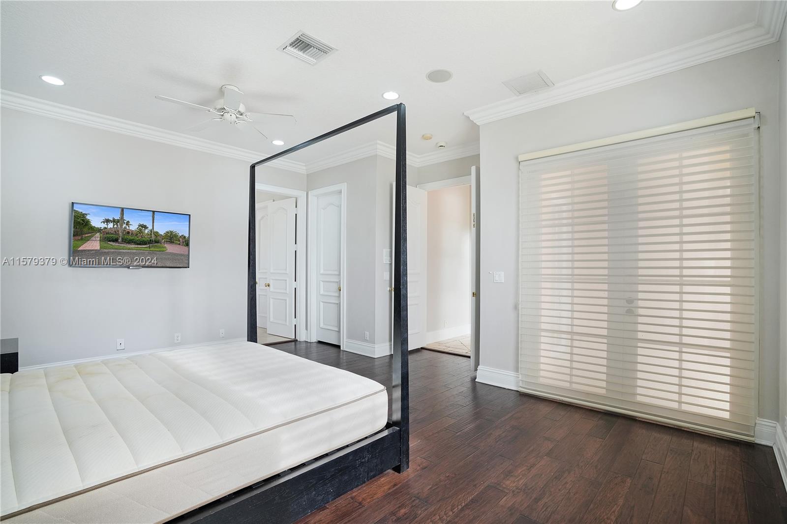 6225 Stallion Way Southwest Ranches, FL 33330 - Photo 23 of 56 a bedroom with a large bed and a window