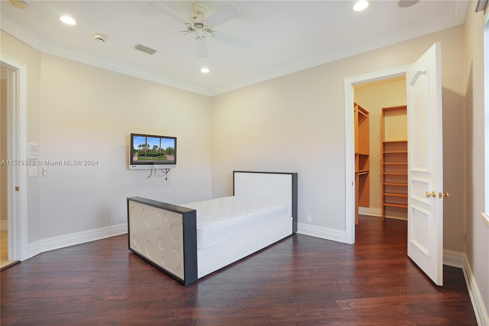 6225 Stallion Way Southwest Ranches, FL 33330 - Photo 24 of 56 a view of a livingroom with wooden floor and a ceiling fan