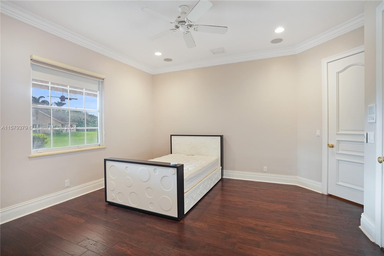 6225 Stallion Way Southwest Ranches, FL 33330 - Photo 26 of 56 an empty room with wooden floor and windows