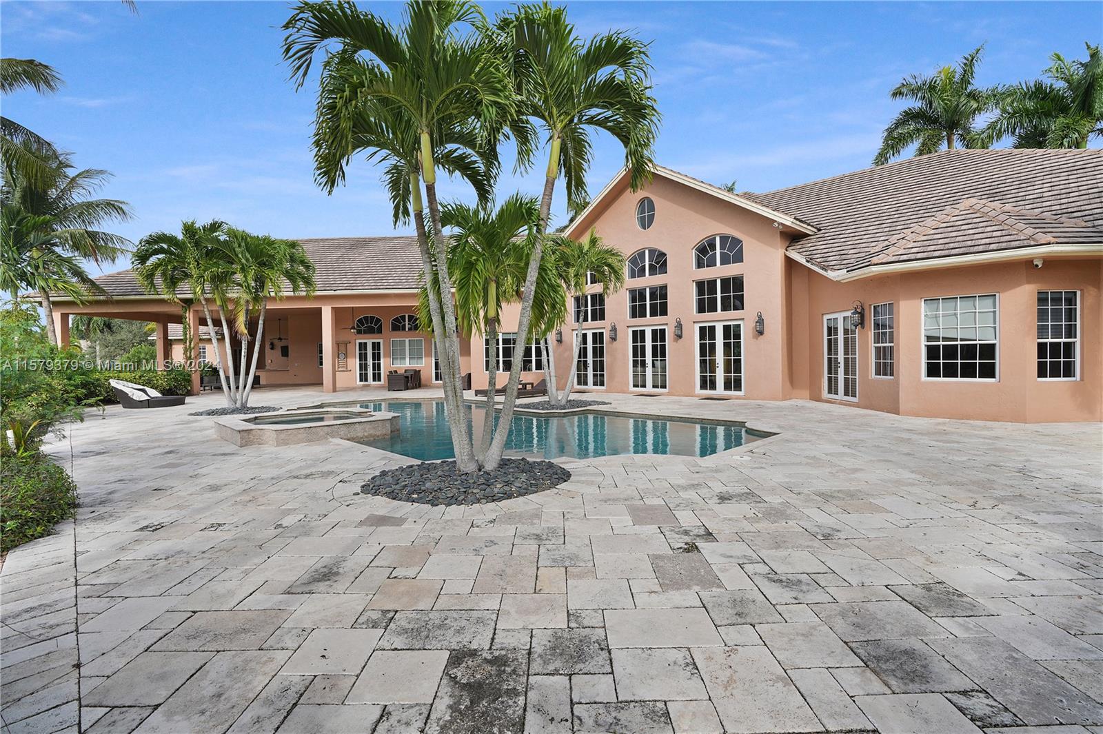6225 Stallion Way Southwest Ranches, FL 33330 - Photo 35 of 56 a view of a white house with a yard and potted plants