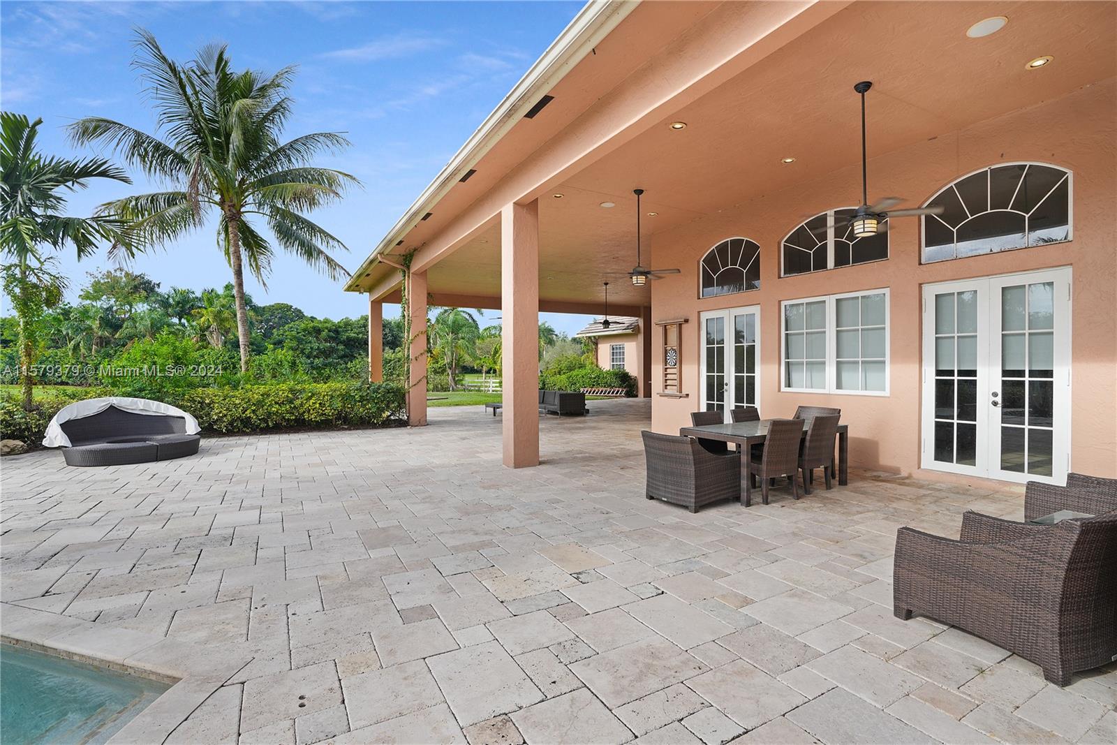 6225 Stallion Way Southwest Ranches, FL 33330 - Photo 39 of 56 a view of a patio with couches and potted plants