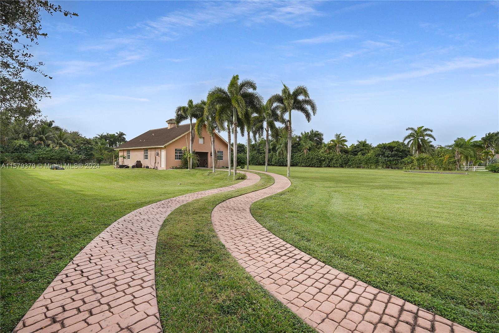 6225 Stallion Way Southwest Ranches, FL 33330 - Photo 47 of 56 a view of a garden with a lake