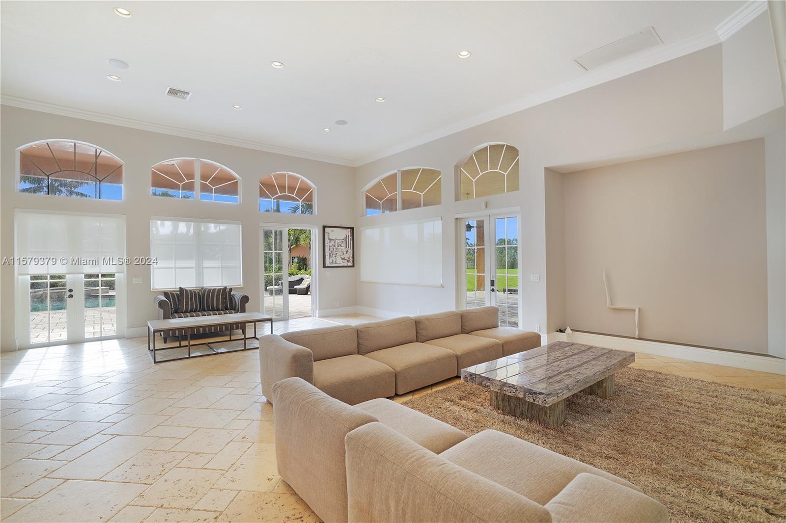 6225 Stallion Way Southwest Ranches, FL 33330 - Photo 5 of 56 a living room with furniture and a floor to ceiling window