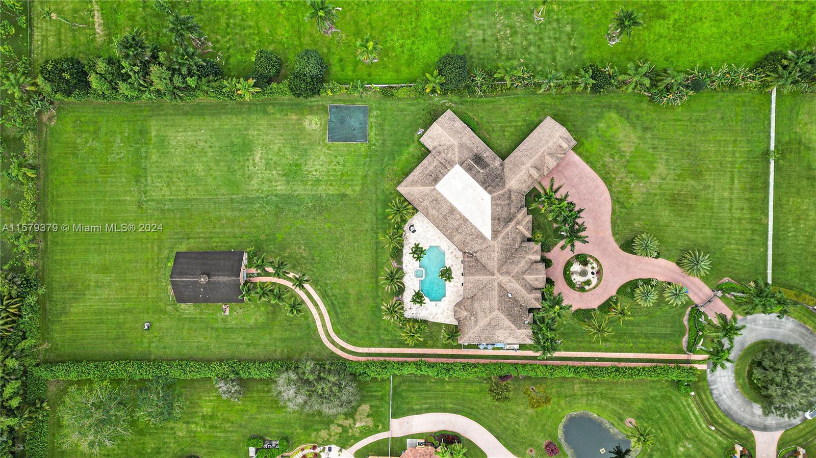 6225 Stallion Way Southwest Ranches, FL 33330 - Photo 51 of 56 an aerial view of a house having swimming pool garden view and lake view