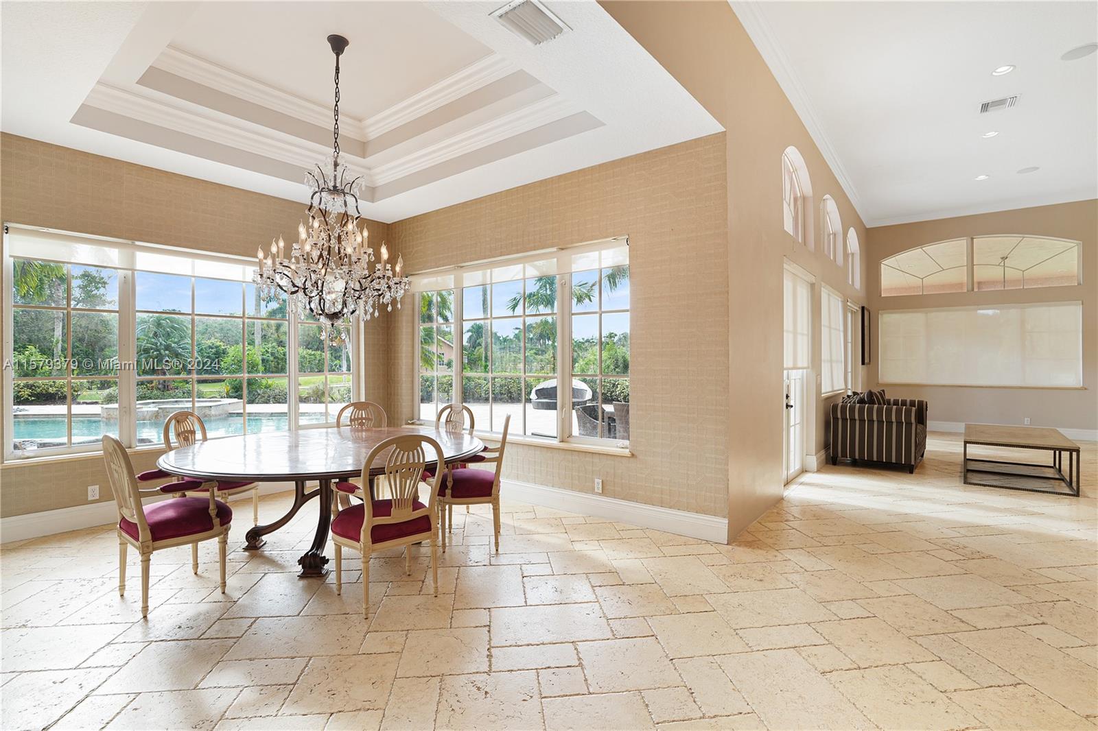 6225 Stallion Way Southwest Ranches, FL 33330 - Photo 6 of 56 a living room with furniture and a chandelier