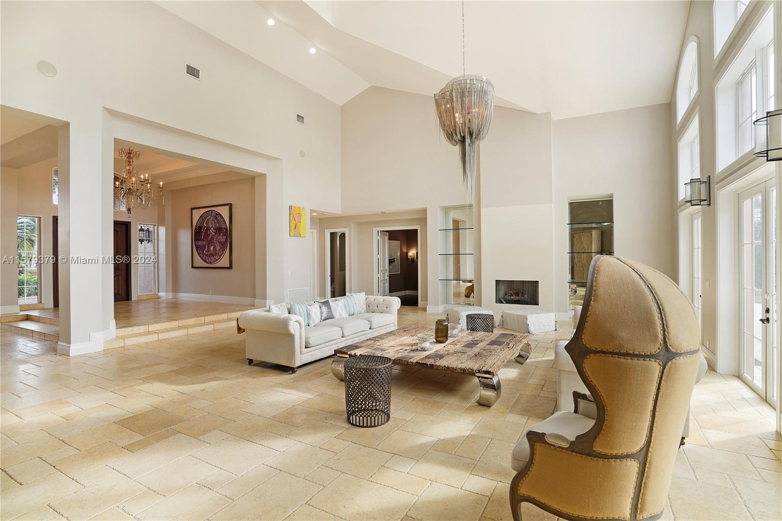 6225 Stallion Way Southwest Ranches, FL 33330 - Photo 9 of 56 a living room with furniture and a chandelier