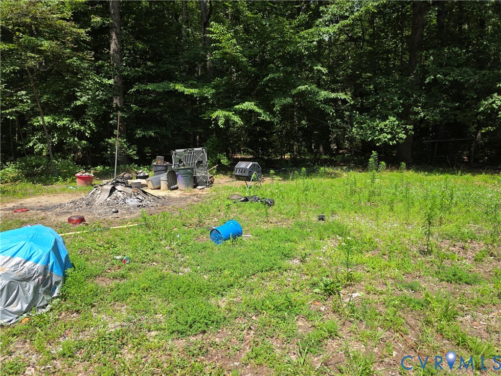 3161 Dorrell Road Aylett, VA 23009 - Photo 28 of 41 a view of a backyard with a sitting area