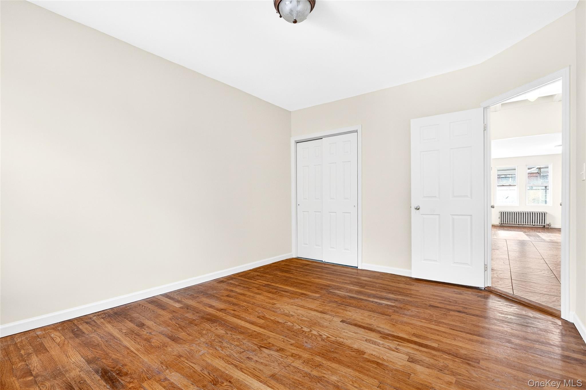 989 Sacket Avenue Bronx, NY 10462 - Photo 12 of 29 a view of empty room with wooden floor