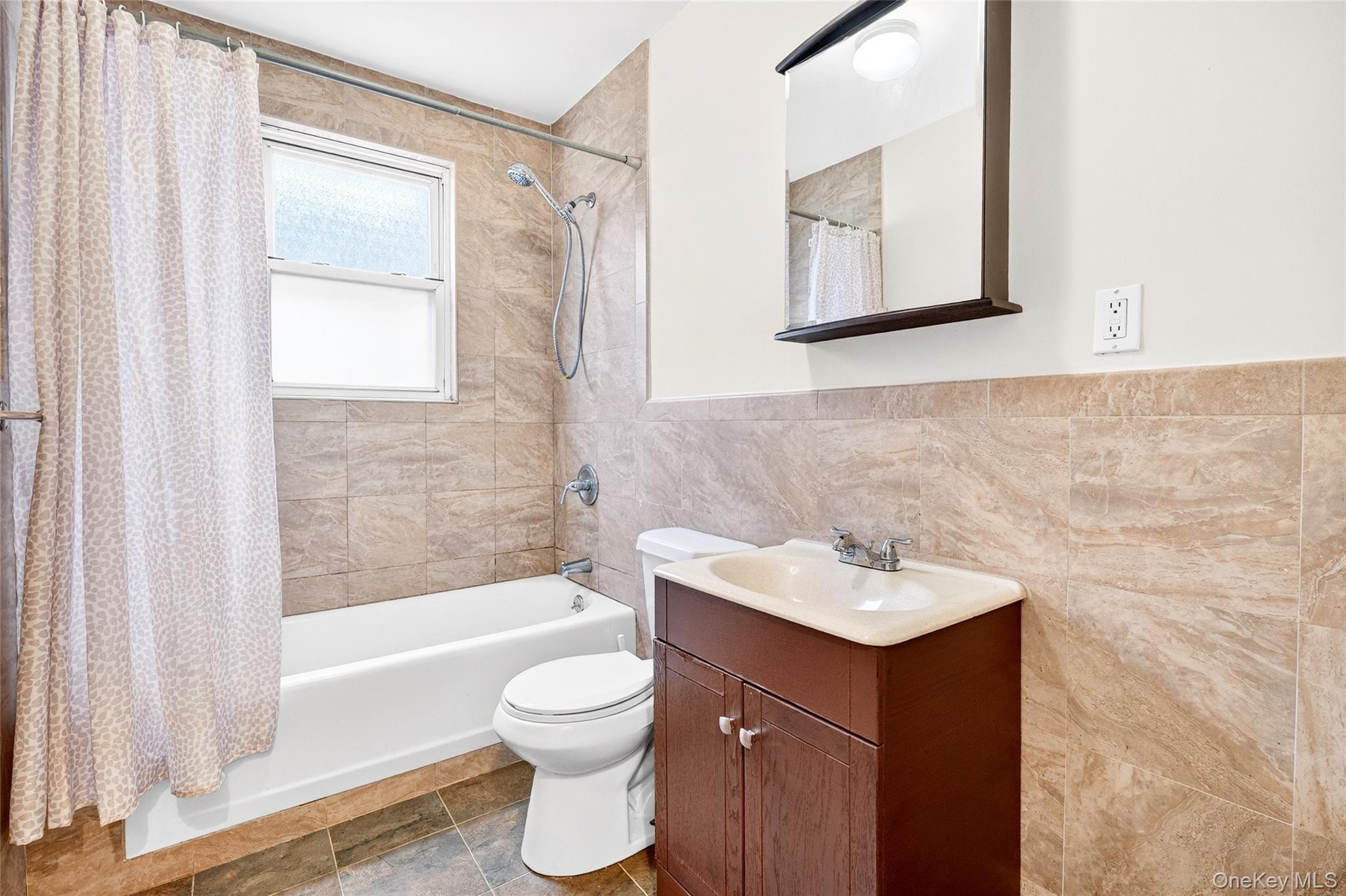 989 Sacket Avenue Bronx, NY 10462 - Photo 16 of 29 a bathroom with a sink toilet and shower
