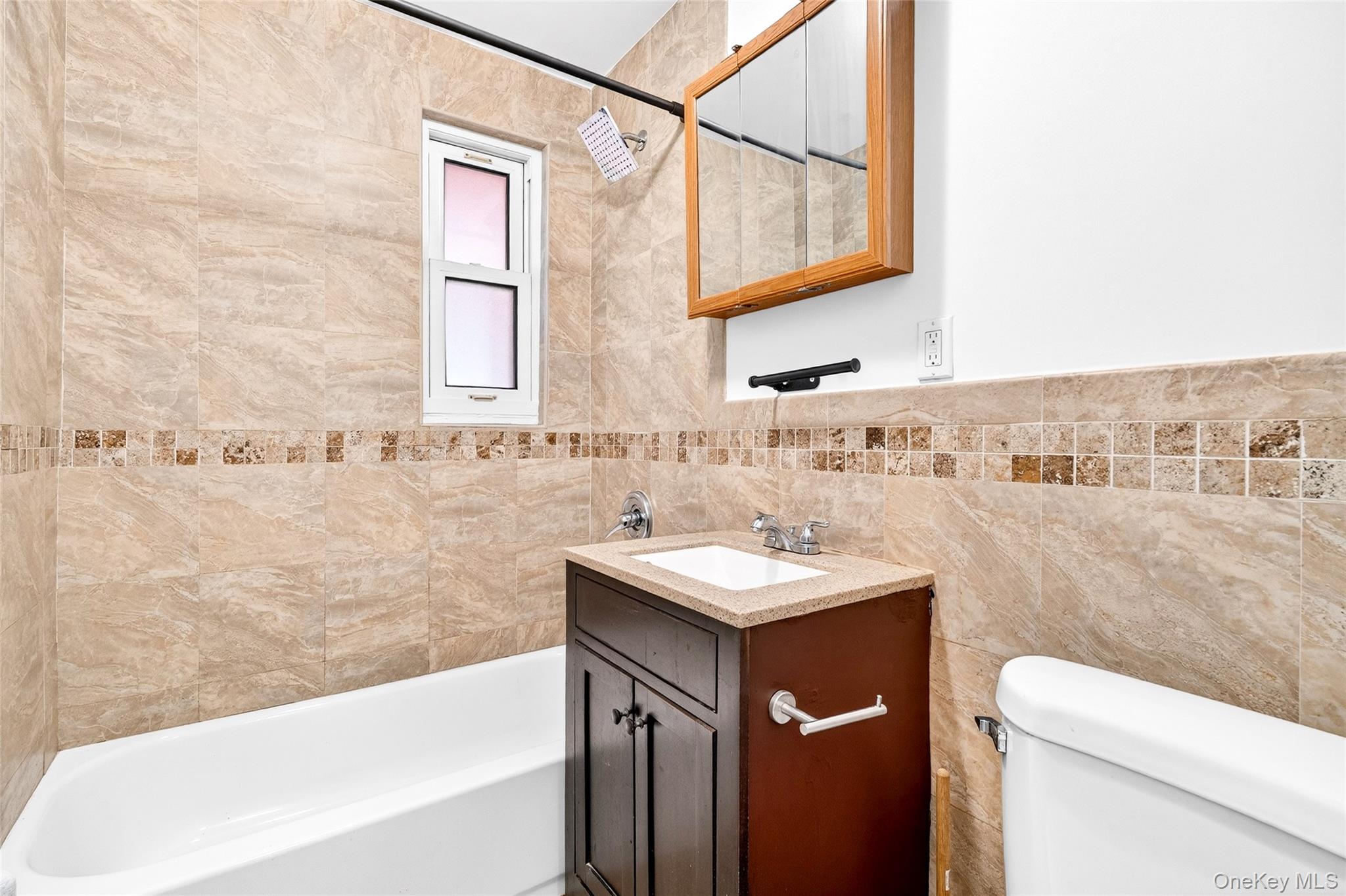 989 Sacket Avenue Bronx, NY 10462 - Photo 25 of 29 a bathroom with a sink a toilet and shower