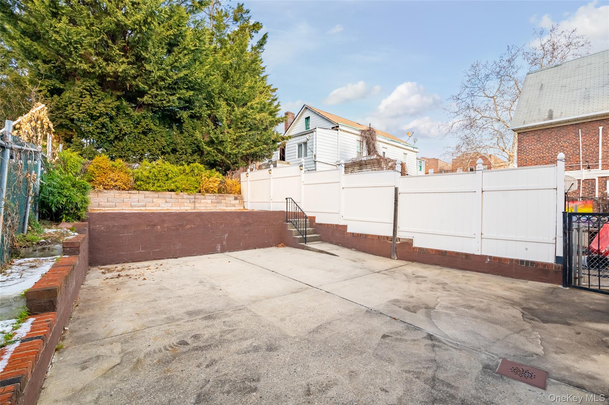 989 Sacket Avenue Bronx, NY 10462 - Photo 29 of 29 a view of a white house with a snow in the background