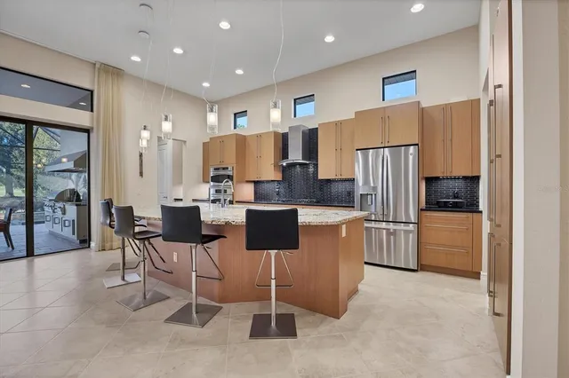 a kitchen with granite countertop a sink and a stove