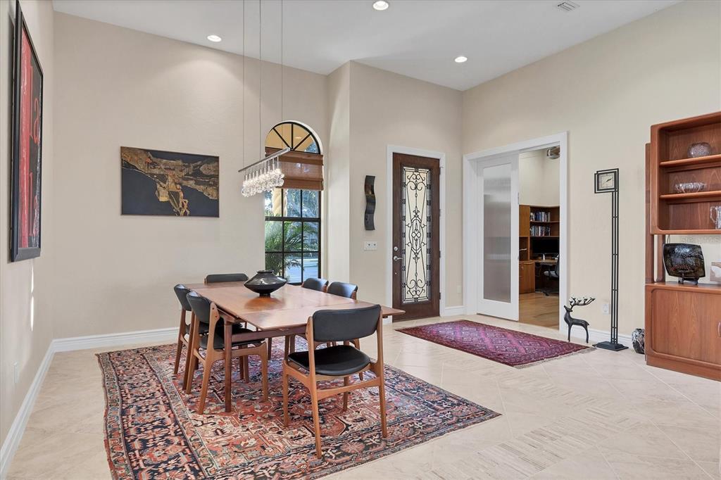 14519 Leopard Creek Place Lakewood Ranch, FL 34202 - Photo 20 of 56 a dining room with furniture and window
