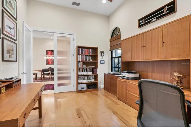 a spacious bathroom with a granite countertop sink a toilet a mirror and shower