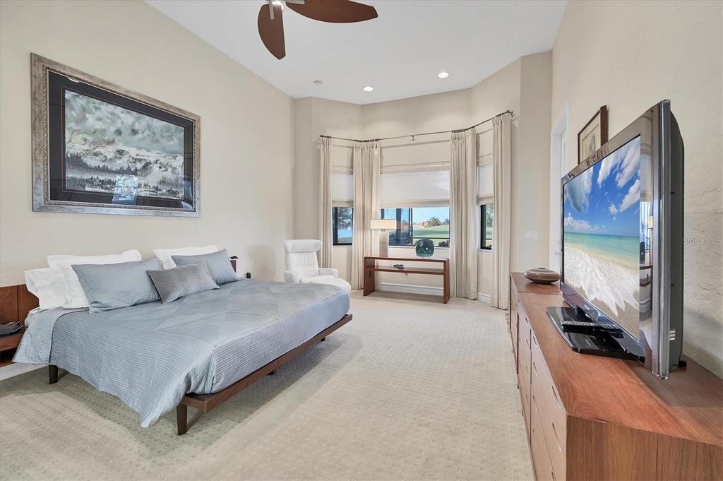 14519 Leopard Creek Place Lakewood Ranch, FL 34202 - Photo 23 of 56 a living room with furniture and a flat screen tv